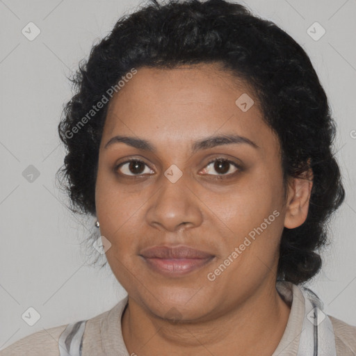 Joyful black young-adult female with long  brown hair and brown eyes