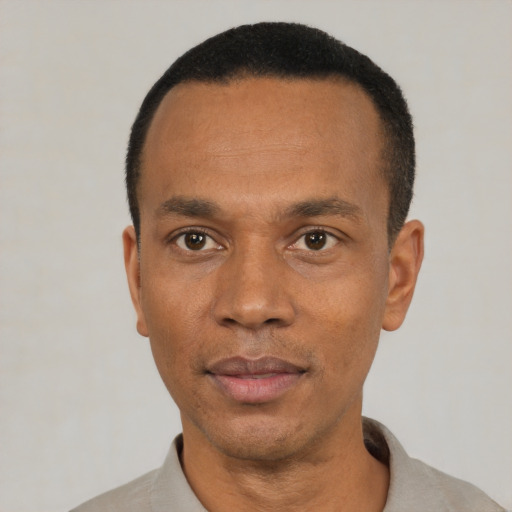Neutral black adult male with short  black hair and brown eyes