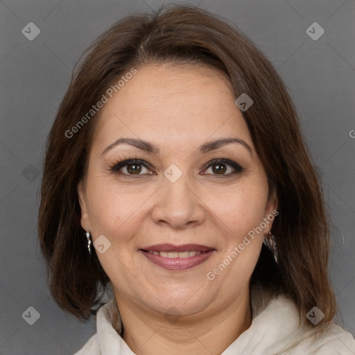 Joyful white adult female with medium  brown hair and brown eyes