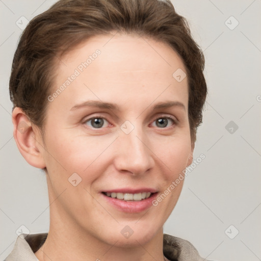 Joyful white young-adult female with short  brown hair and grey eyes