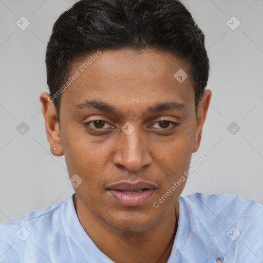Joyful latino young-adult male with short  brown hair and brown eyes