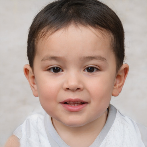 Joyful white child male with short  brown hair and brown eyes