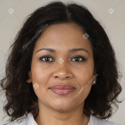 Joyful black adult female with medium  brown hair and brown eyes