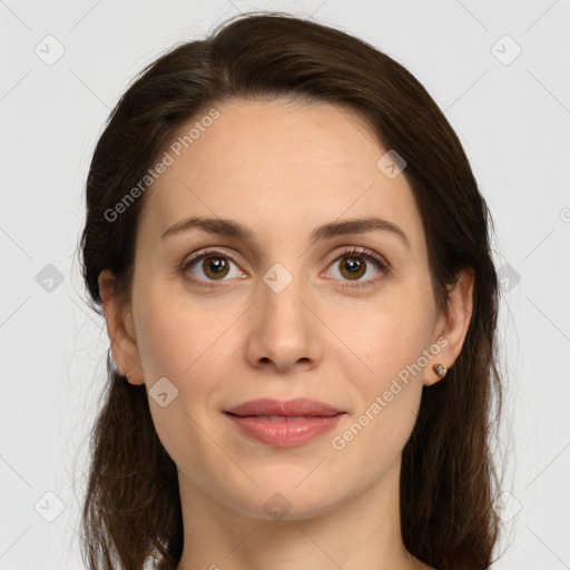 Joyful white young-adult female with long  brown hair and green eyes