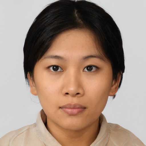 Neutral asian young-adult female with medium  black hair and brown eyes