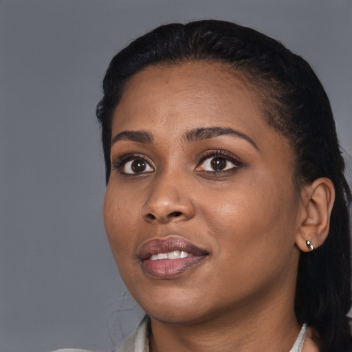 Joyful black young-adult female with medium  black hair and brown eyes