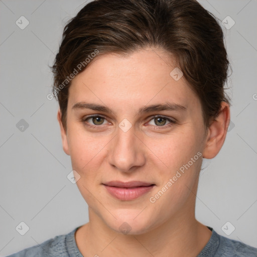 Joyful white young-adult female with short  brown hair and grey eyes