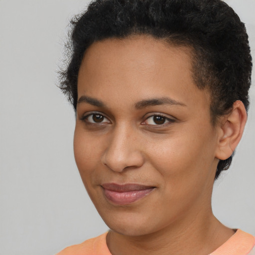 Joyful latino young-adult female with short  brown hair and brown eyes