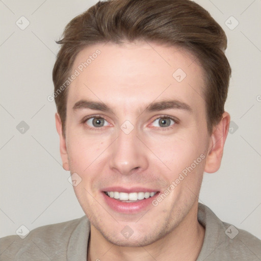 Joyful white young-adult male with short  brown hair and grey eyes