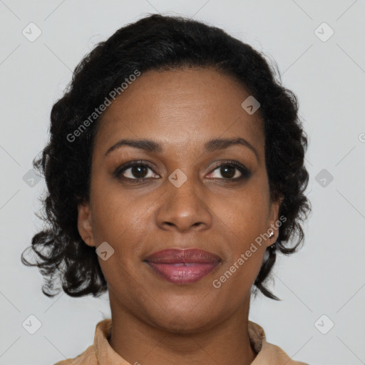 Joyful black adult female with medium  brown hair and brown eyes