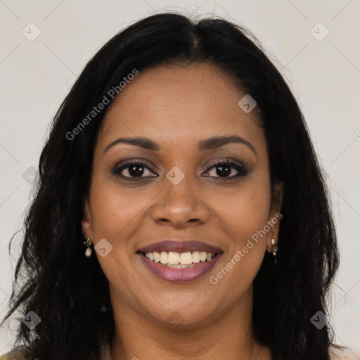 Joyful black young-adult female with long  brown hair and brown eyes