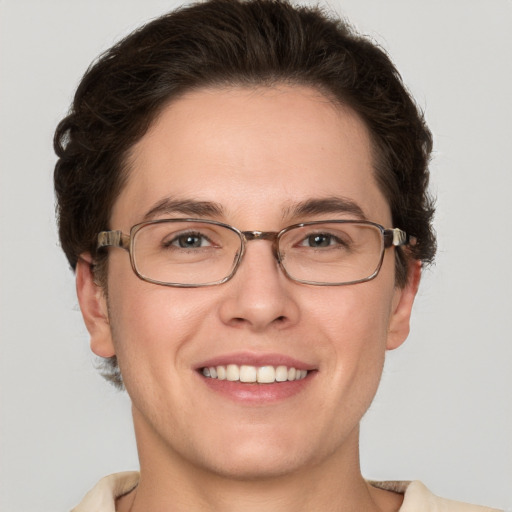 Joyful white adult male with short  brown hair and green eyes