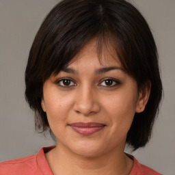 Joyful white young-adult female with medium  brown hair and brown eyes