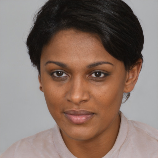 Joyful asian young-adult female with short  brown hair and brown eyes