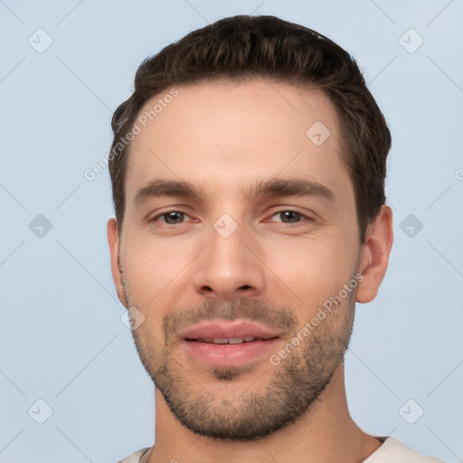 Joyful white young-adult male with short  brown hair and brown eyes