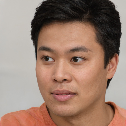 Neutral asian young-adult male with short  brown hair and brown eyes