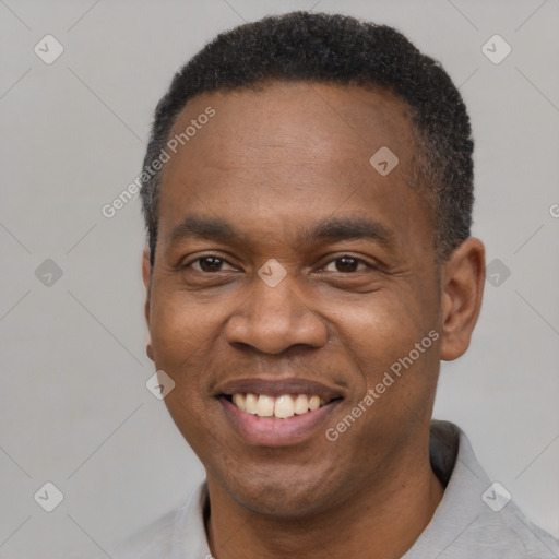 Joyful latino adult male with short  black hair and brown eyes