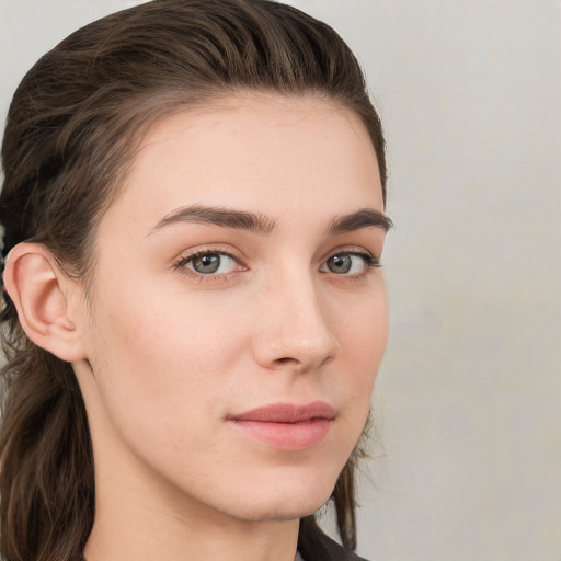 Neutral white young-adult female with long  brown hair and grey eyes