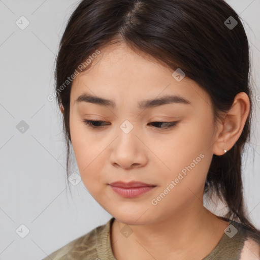 Joyful asian young-adult female with medium  brown hair and brown eyes