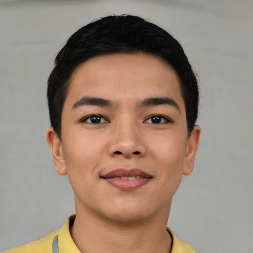 Joyful asian young-adult male with short  black hair and brown eyes
