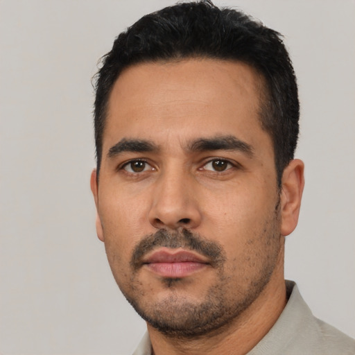 Neutral latino young-adult male with short  black hair and brown eyes