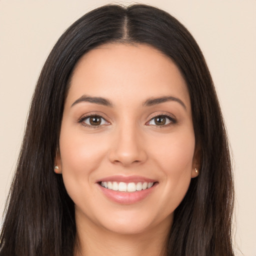 Joyful white young-adult female with long  brown hair and brown eyes