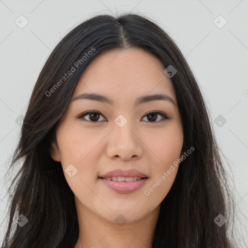 Joyful asian young-adult female with long  brown hair and brown eyes