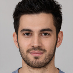 Joyful white young-adult male with short  brown hair and brown eyes