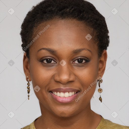 Joyful black young-adult female with short  brown hair and brown eyes