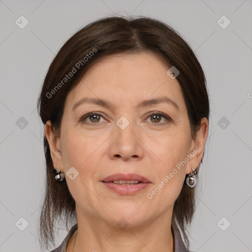 Joyful white adult female with medium  brown hair and grey eyes