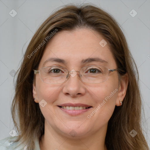 Joyful white adult female with long  brown hair and brown eyes