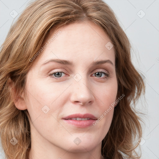 Joyful white young-adult female with long  brown hair and blue eyes