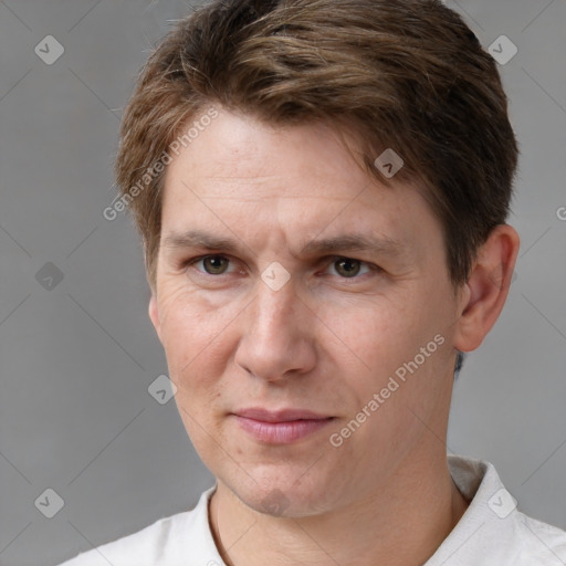 Joyful white adult male with short  brown hair and brown eyes