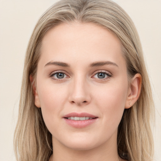 Joyful white young-adult female with long  brown hair and grey eyes