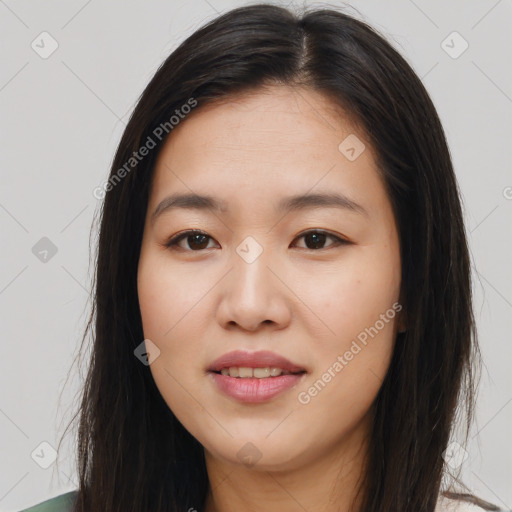 Joyful asian young-adult female with long  brown hair and brown eyes