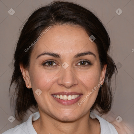 Joyful white adult female with medium  brown hair and brown eyes