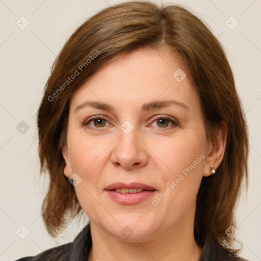 Joyful white adult female with medium  brown hair and grey eyes