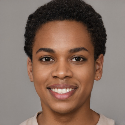 Joyful latino young-adult female with short  black hair and brown eyes