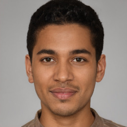 Joyful latino young-adult male with short  brown hair and brown eyes