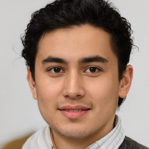 Joyful latino young-adult male with short  brown hair and brown eyes