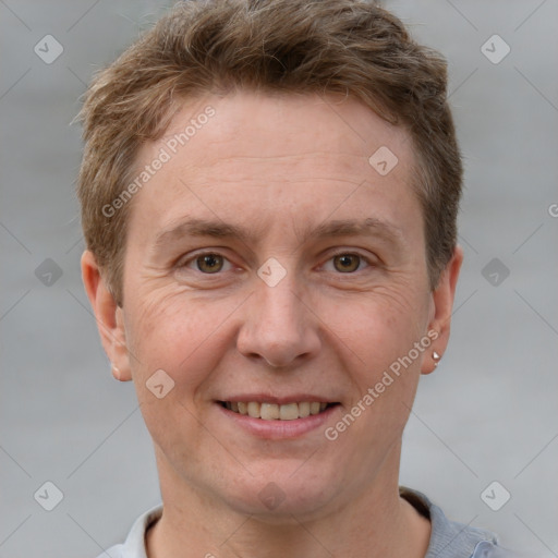 Joyful white adult male with short  brown hair and grey eyes