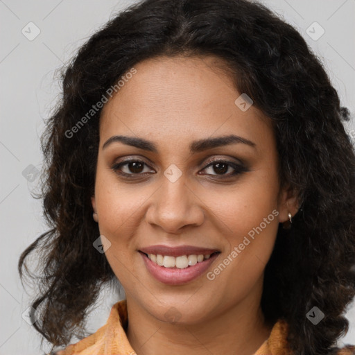 Joyful black young-adult female with long  brown hair and brown eyes