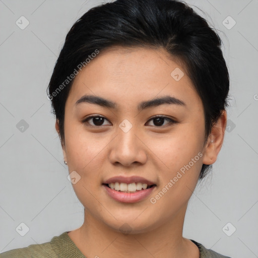 Joyful asian young-adult female with short  black hair and brown eyes