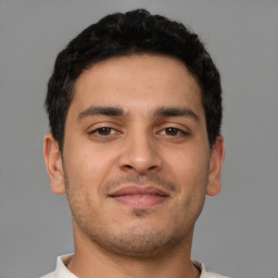 Neutral latino young-adult male with short  brown hair and brown eyes