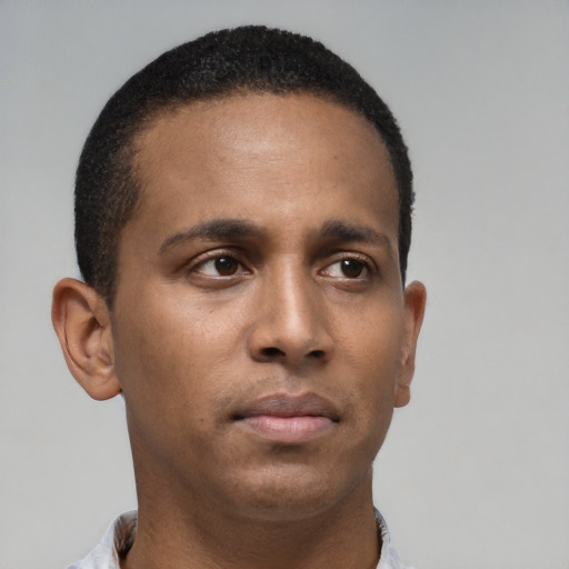 Neutral black young-adult male with short  black hair and brown eyes