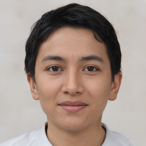 Joyful latino young-adult female with short  black hair and brown eyes