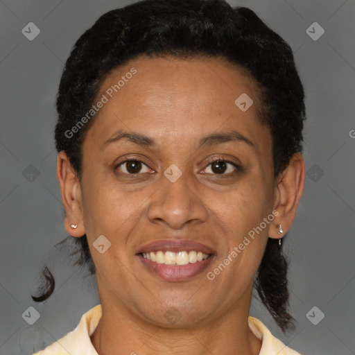 Joyful black adult female with short  brown hair and brown eyes