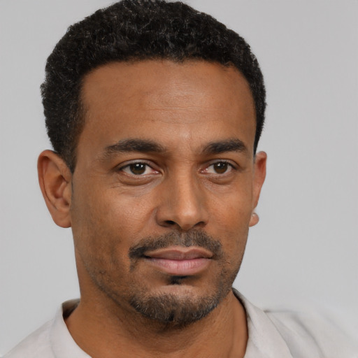Neutral black young-adult male with short  black hair and brown eyes
