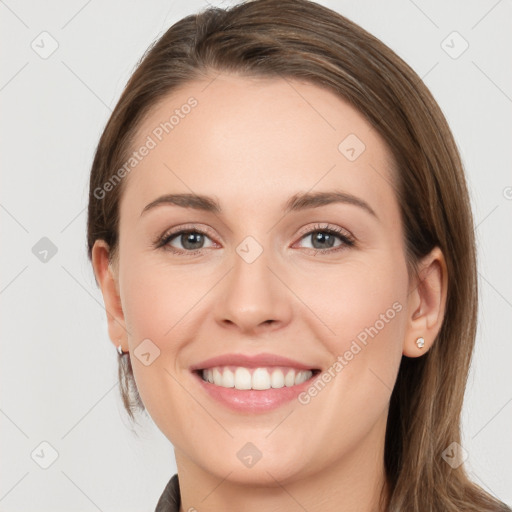 Joyful white young-adult female with long  brown hair and grey eyes