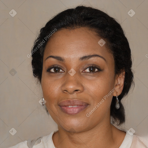 Joyful black adult female with medium  brown hair and brown eyes